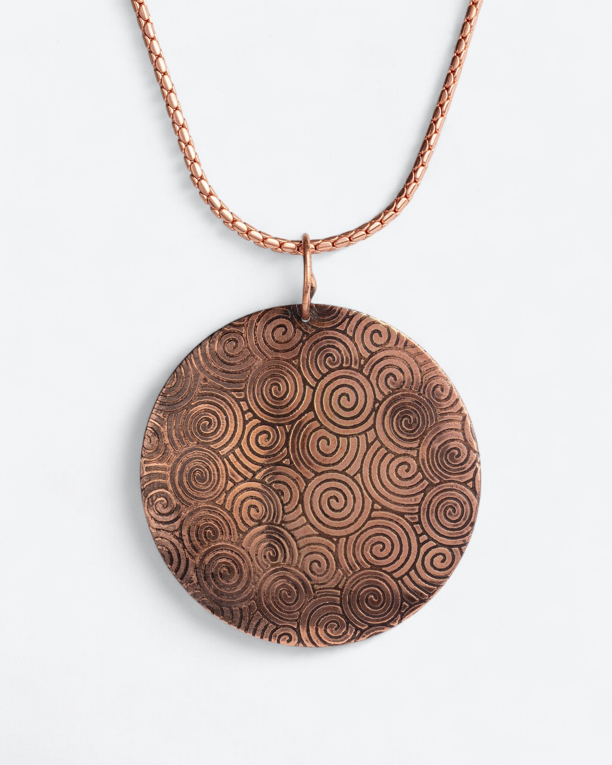 Koperen amulet ketting - Krul patroon