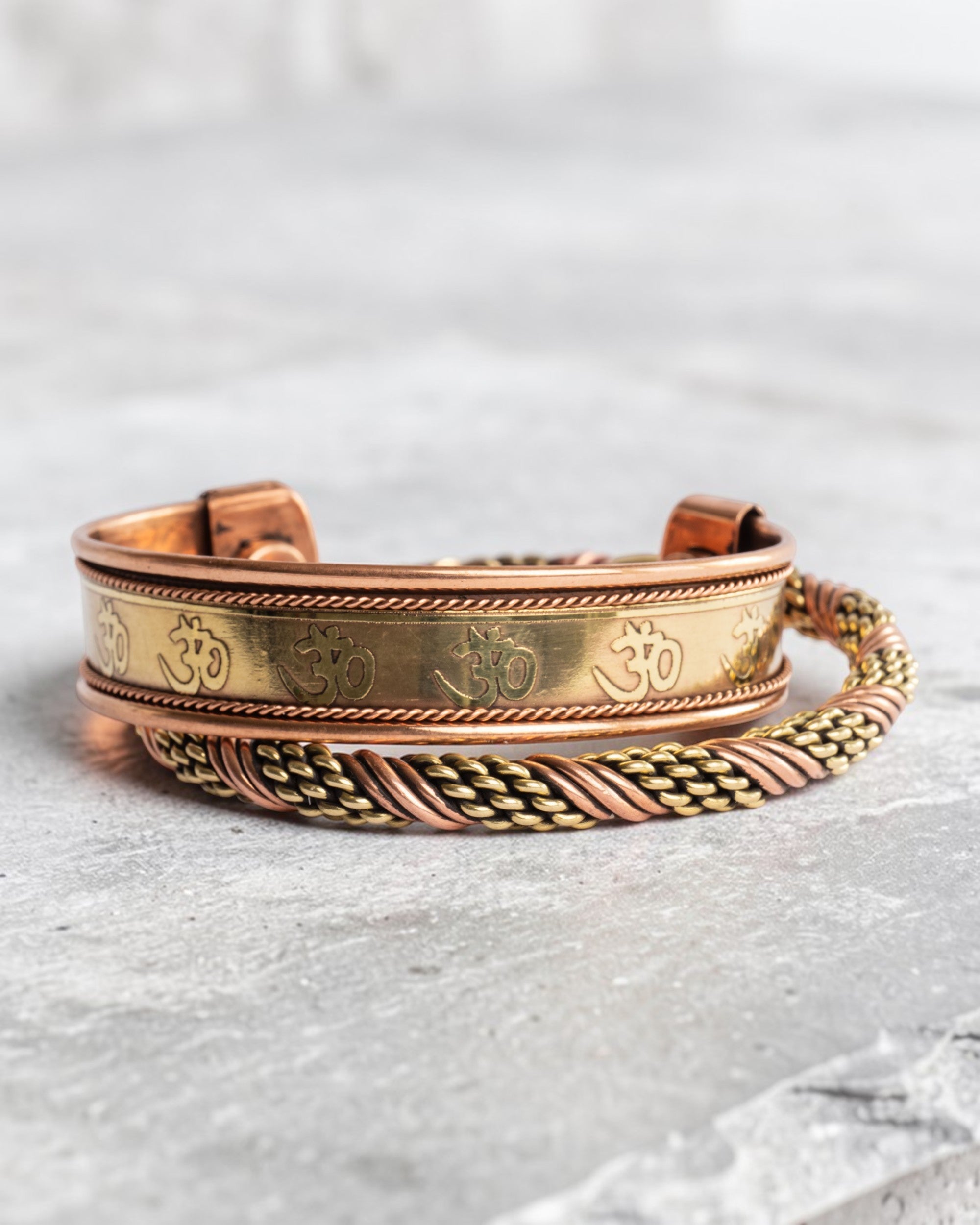 Koperen magneet armband - Om symbool