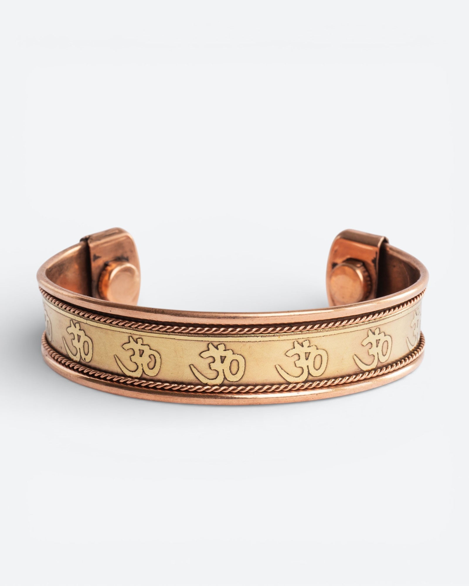 Koperen magneet armband - Om symbool